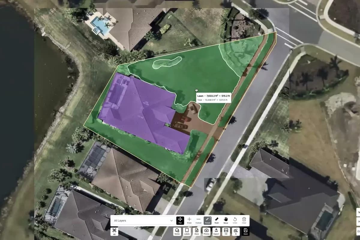 A property measured from aerial imagery, with lawn and hardscape detected as separate coloured surfaces